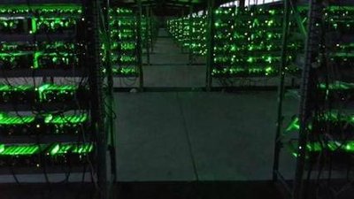 A vast mining farm showcasing rows of mining rigs